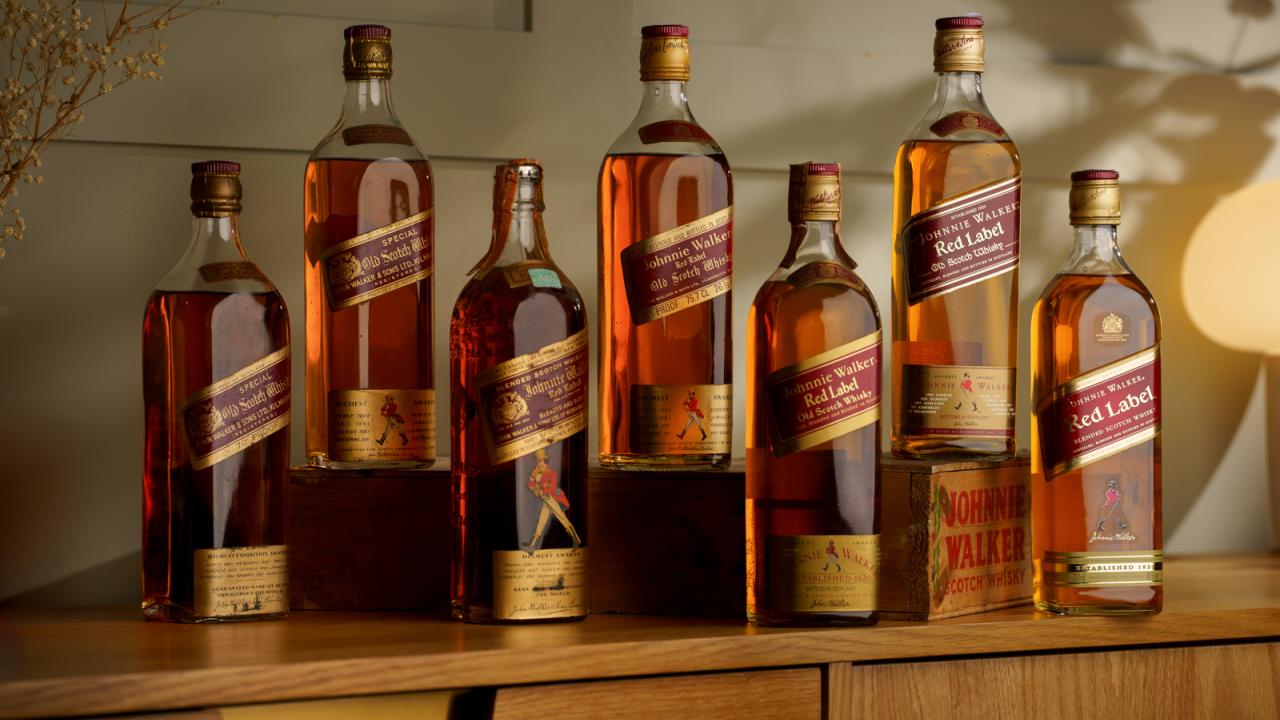 Johnnie Walker Red Label bottles spanning 1930s - 2010s